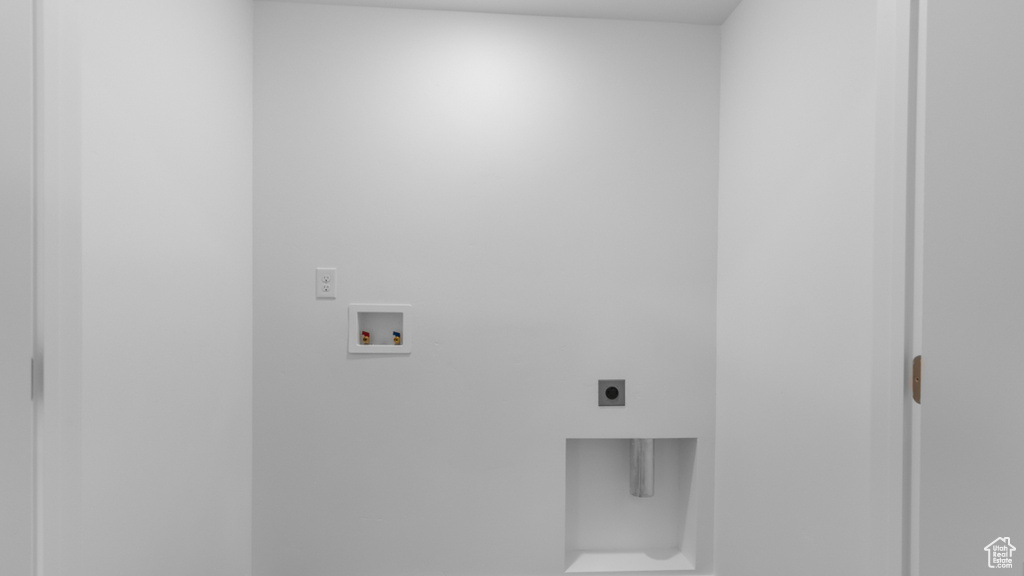 Washroom featuring hookup for an electric dryer and hookup for a washing machine