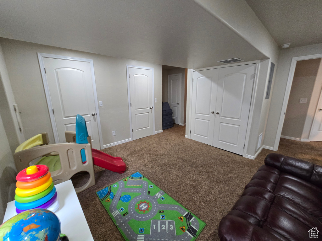 Playroom with carpet and baseboards