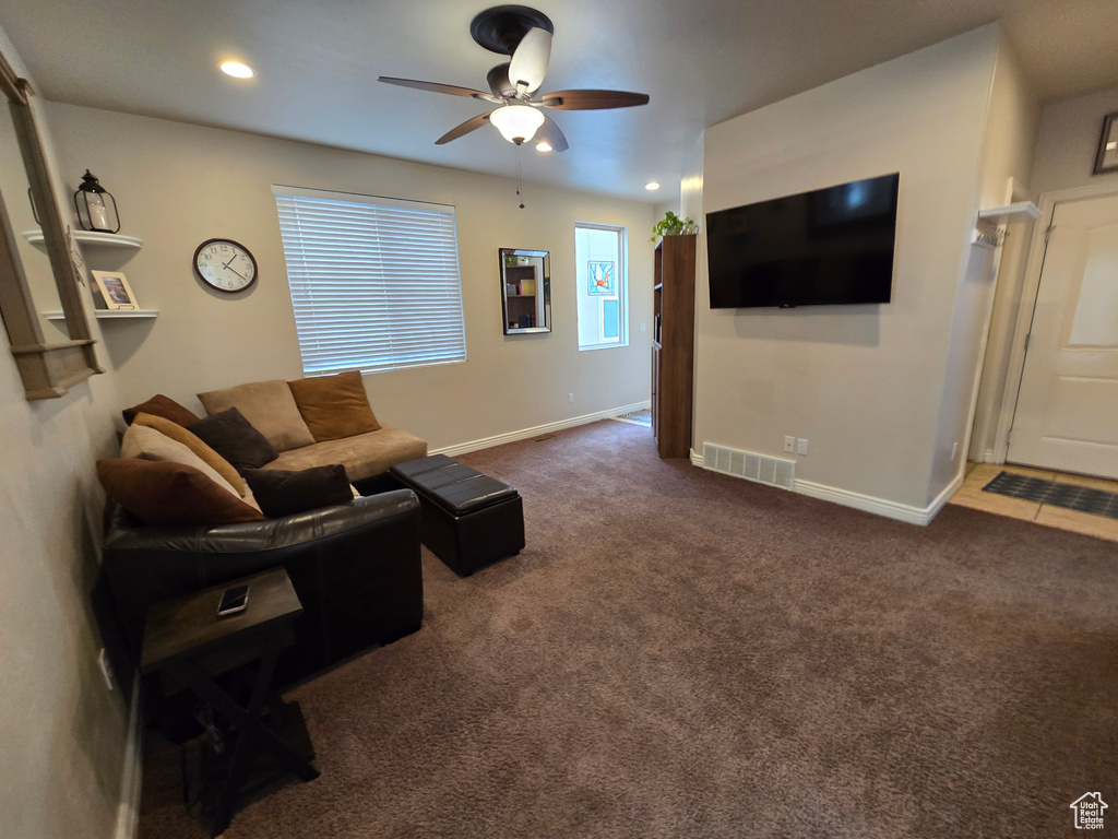 Living room featuring ceiling fan, recessed lighting, carpet flooring, and baseboards