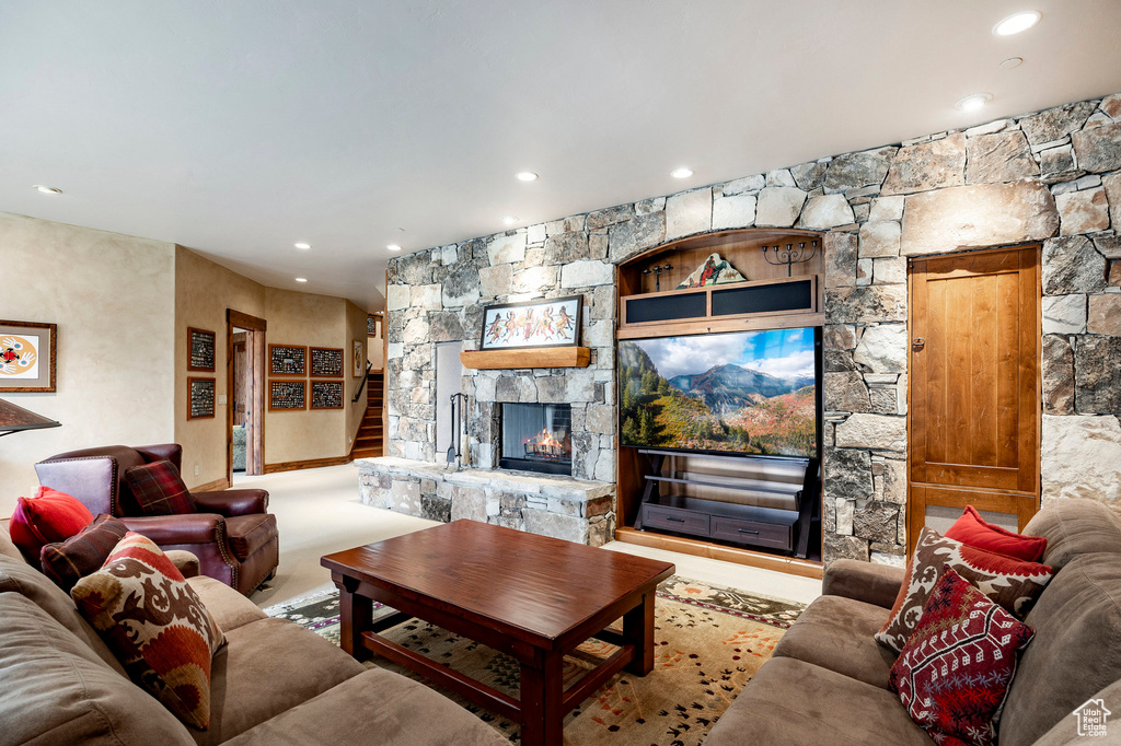 Living area with a fireplace and recessed lighting