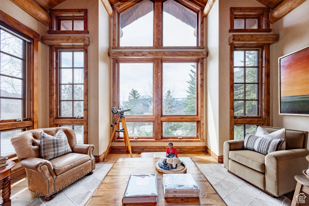Sunroom featuring lofted ceiling