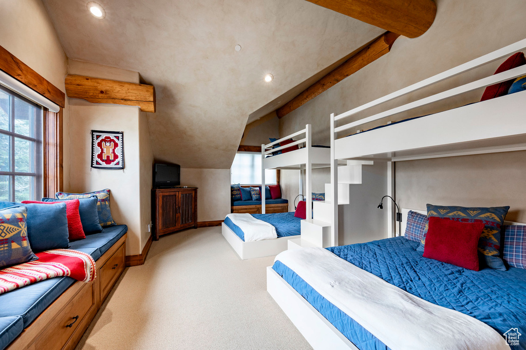 Carpeted bedroom with baseboards, recessed lighting, and lofted ceiling