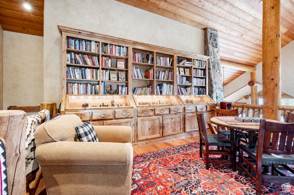 Sitting room featuring light wood-style flooring, wooden ceiling, and recessed lighting