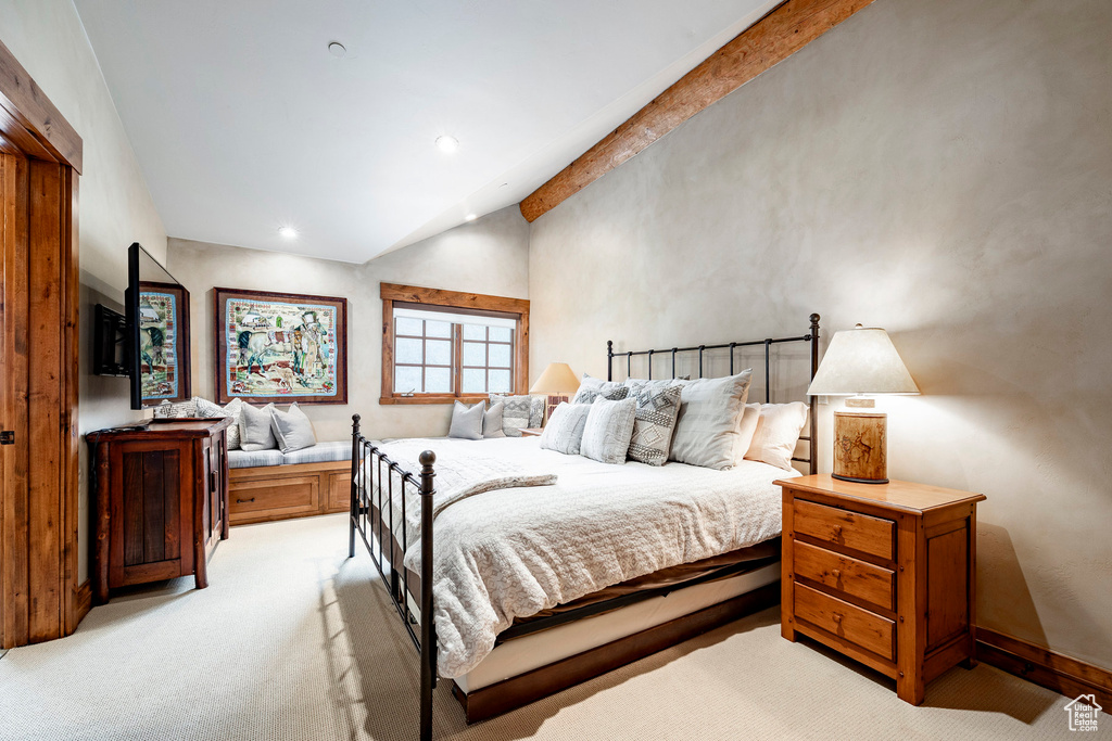 Bedroom featuring vaulted ceiling, light carpet, and recessed lighting