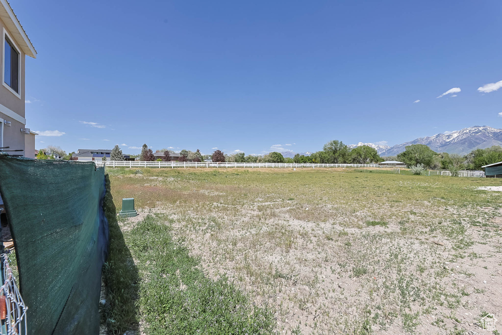 View of yard with a mountain view and a view of countryside
