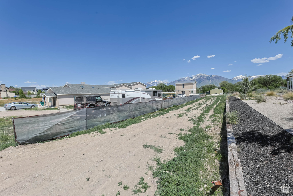 View of dirt / gravel road with a mountain view