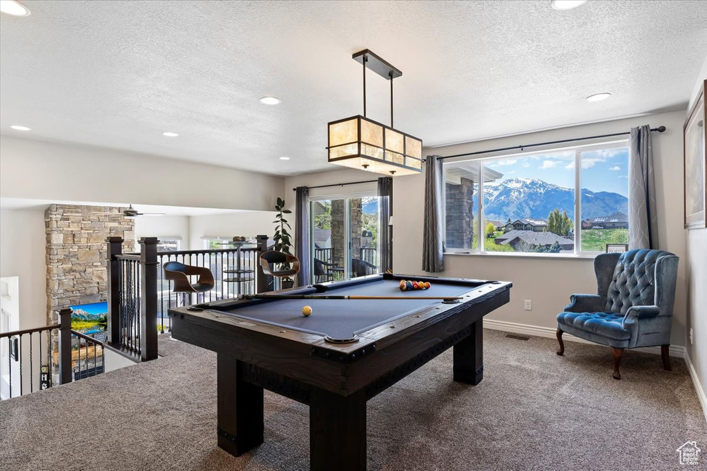 Rec room with carpet, a textured ceiling, a mountain view, billiards, and recessed lighting