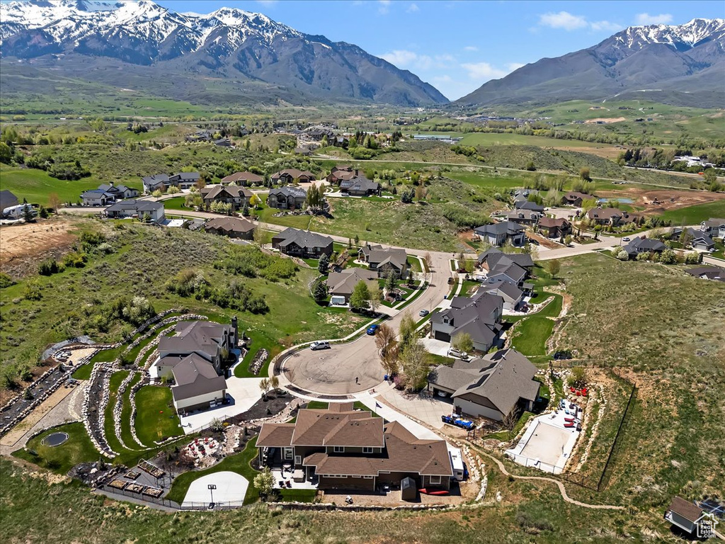 Aerial overview of property\\\\\\\'s location with nearby suburban area and a mountain backdrop