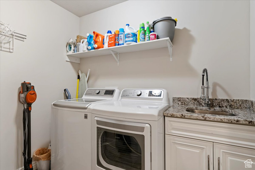 Laundry room with independent washer and dryer and cabinet space