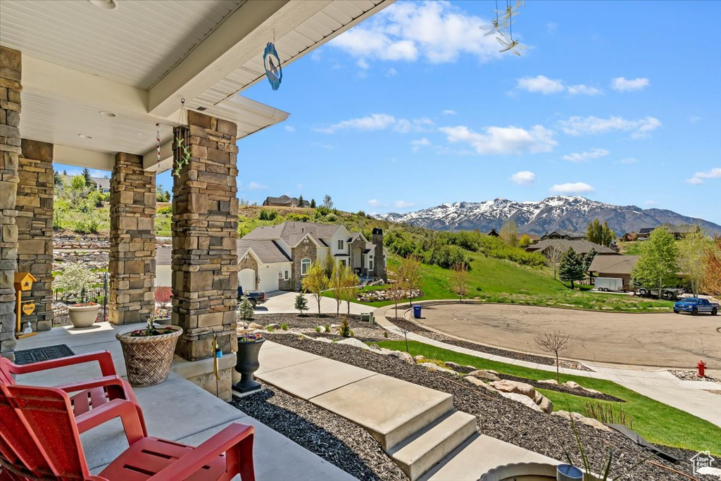 View of patio featuring a mountain view and covered porch