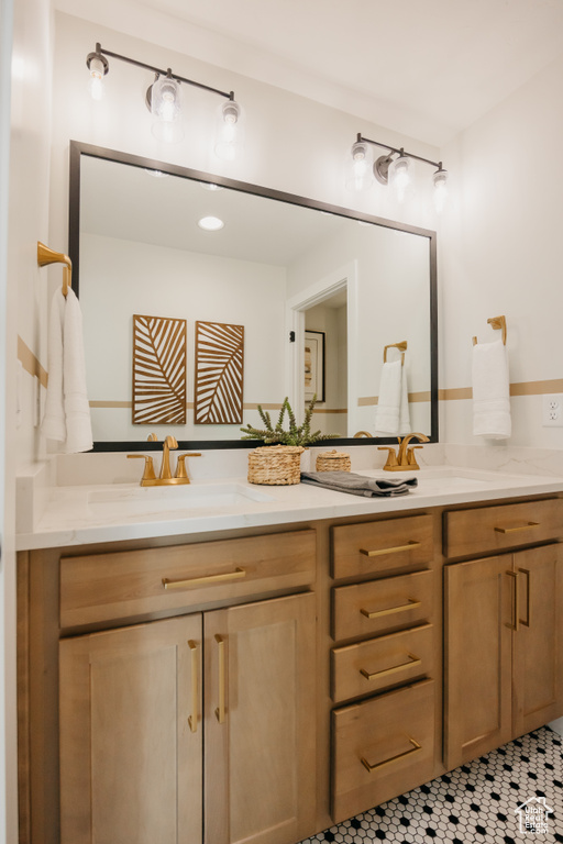 Full bath featuring double vanity