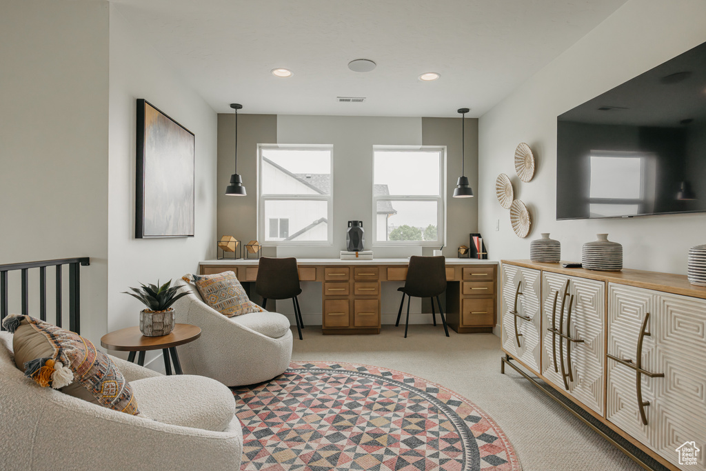 Office space featuring built in study area, light colored carpet, and recessed lighting