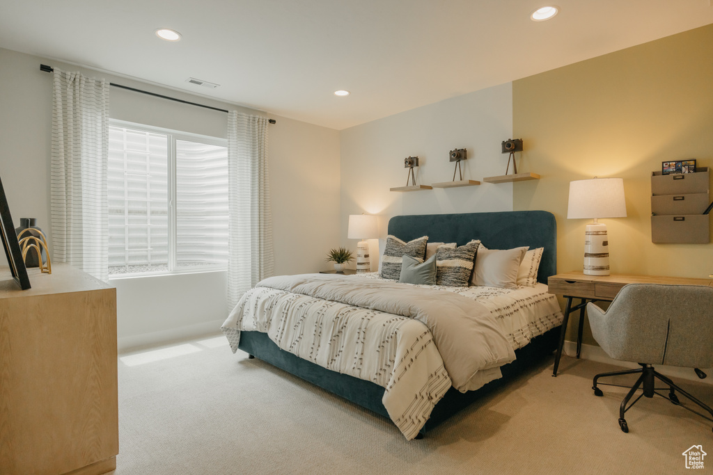 Carpeted bedroom with recessed lighting and baseboards
