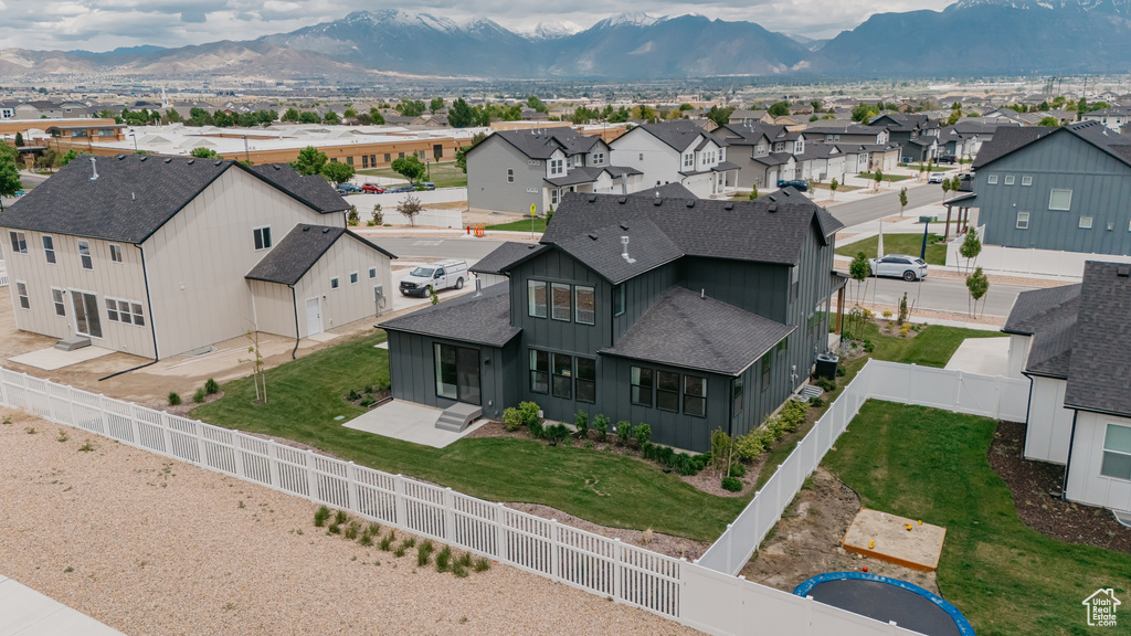 Aerial view of residential area featuring mountains