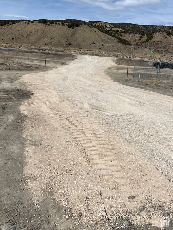 View of dirt / gravel road featuring a rural view