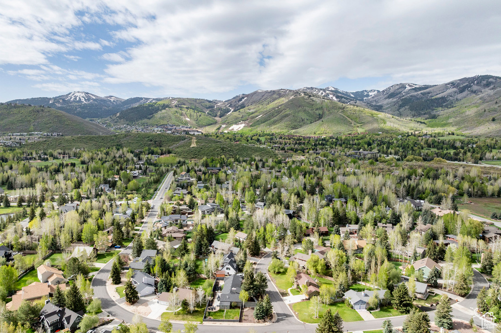 Aerial perspective of suburban area with a mountainous background