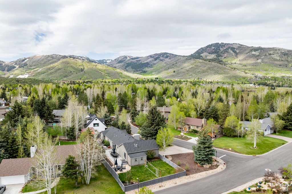 Aerial view of residential area featuring a mountainous background