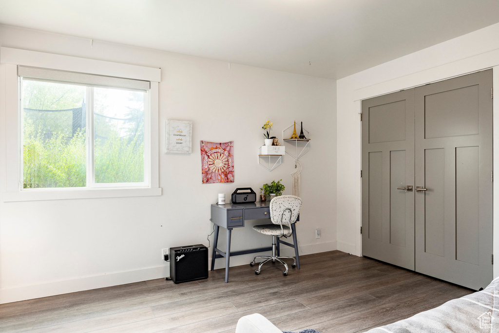 Bedroom featuring light wood finished floors and baseboards