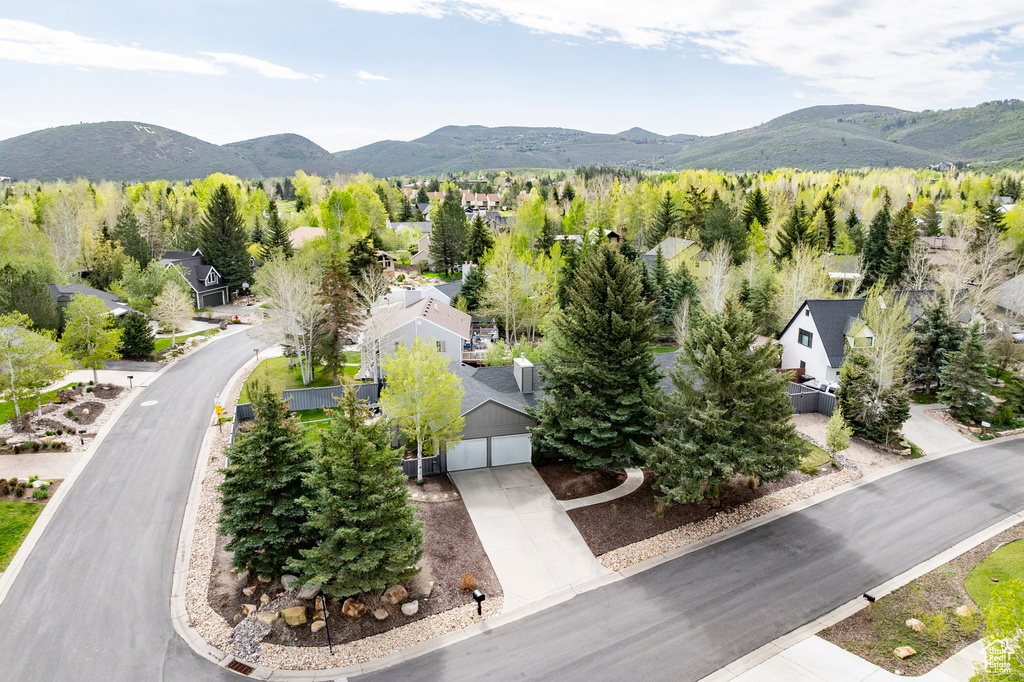 Aerial view of residential area featuring a mountainous background