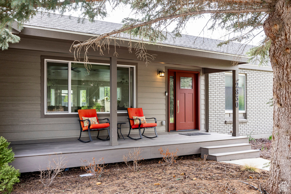 Doorway to property featuring brick siding