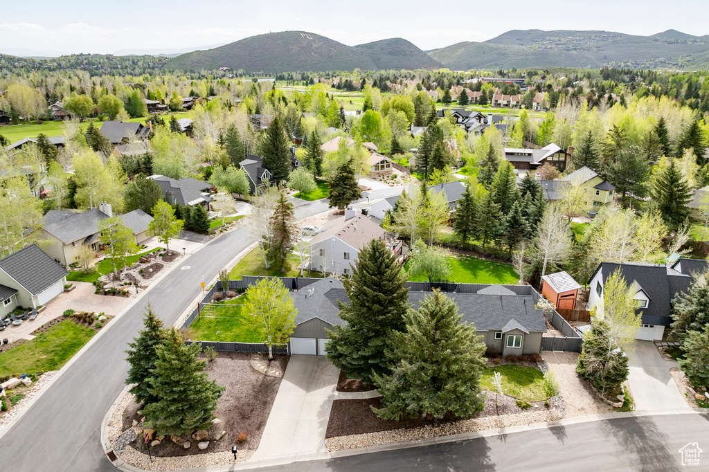 Aerial view of residential area featuring mountains