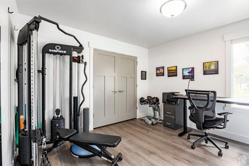 Office space featuring wood finished floors and baseboards