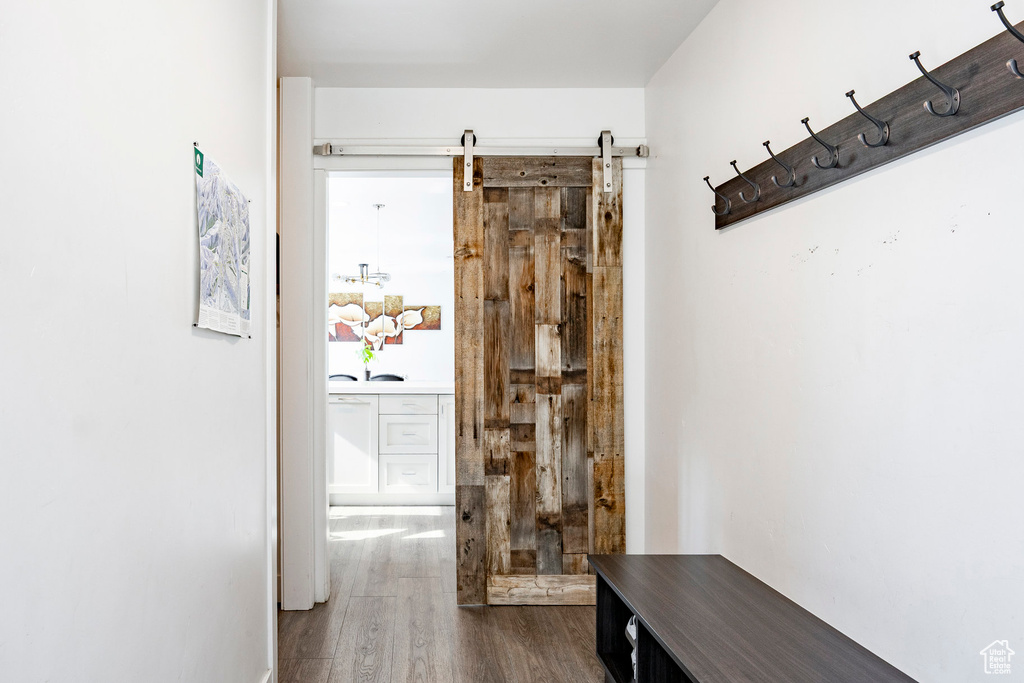 Corridor with dark wood-style flooring
