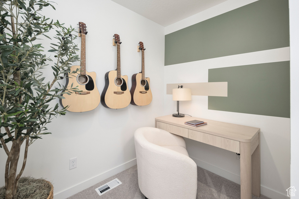 Carpeted office featuring baseboards