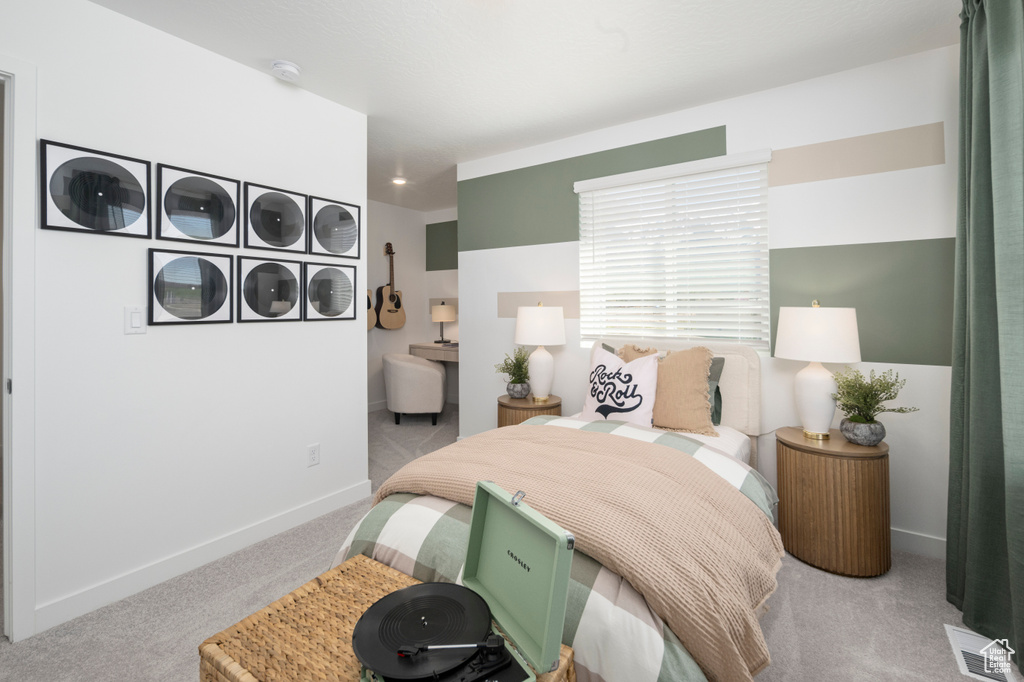 Carpeted bedroom with baseboards