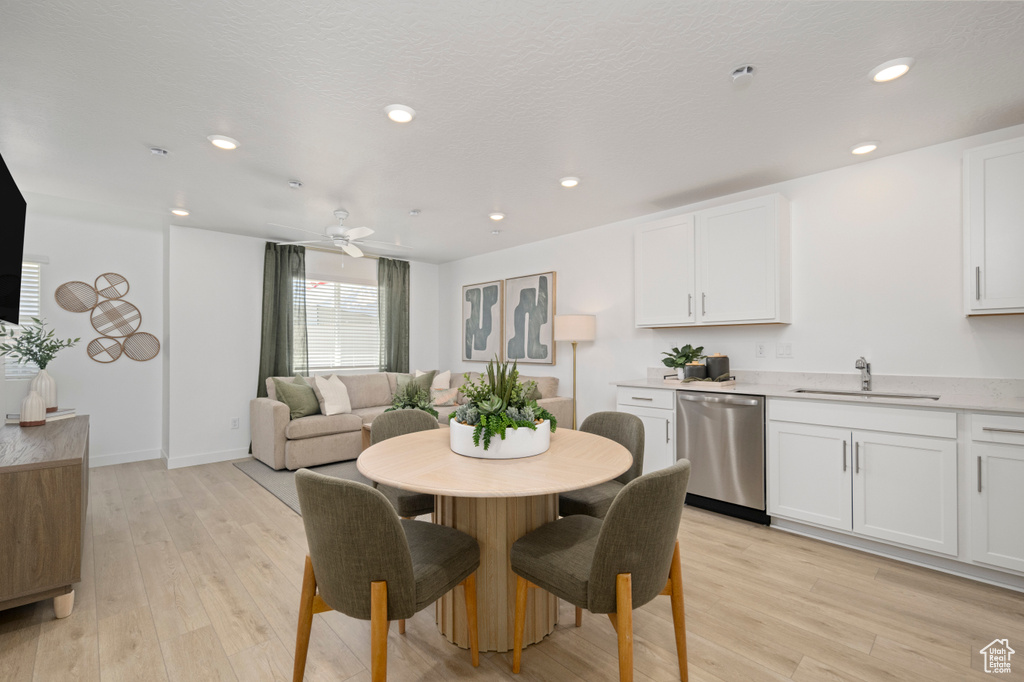 Dining area featuring light wood-style flooring, recessed lighting, ceiling fan, and baseboards