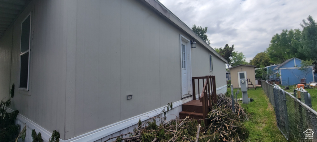 View of home's exterior with fence