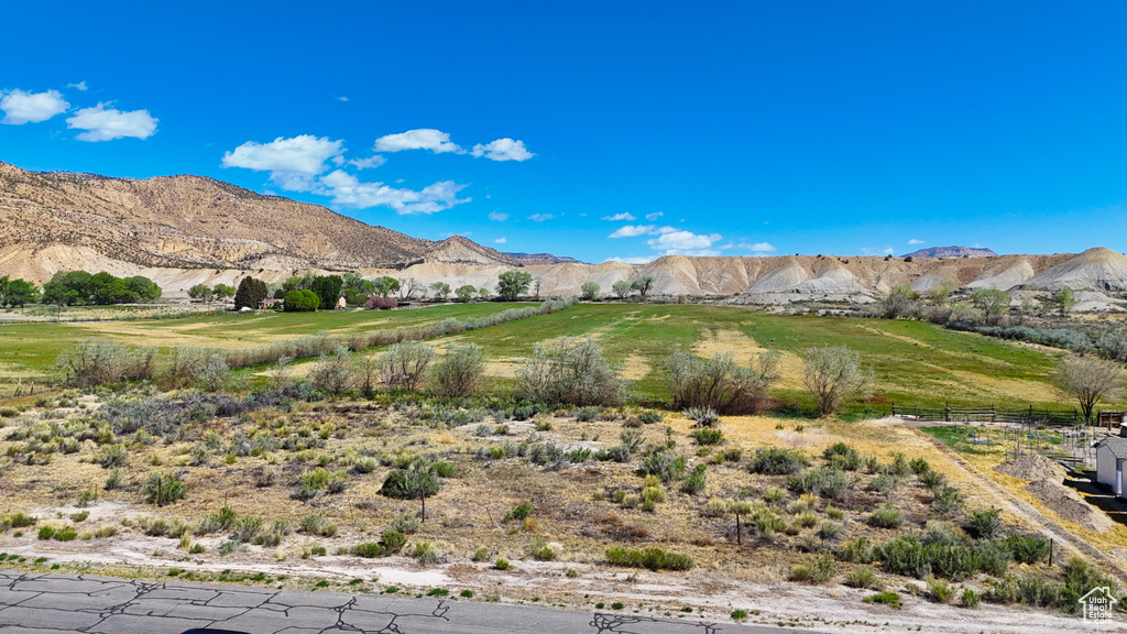 View of mountain backdrop with rural landscape