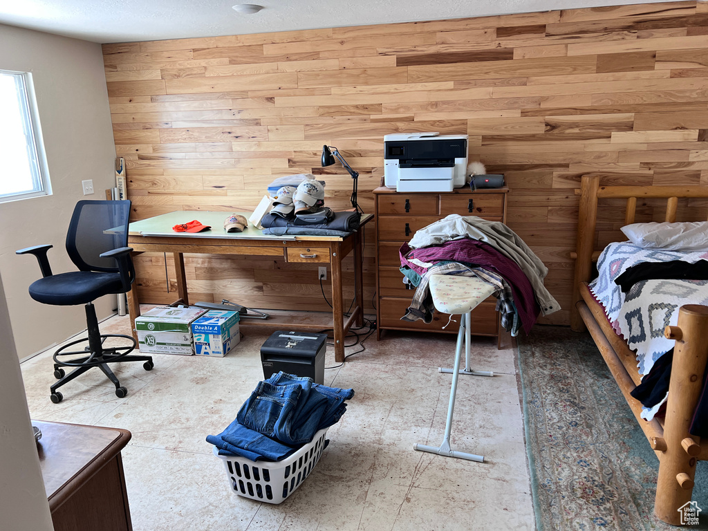 Bedroom with wood walls