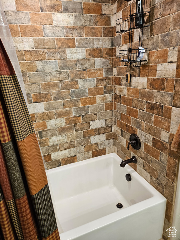 Bathroom featuring shower / tub combo