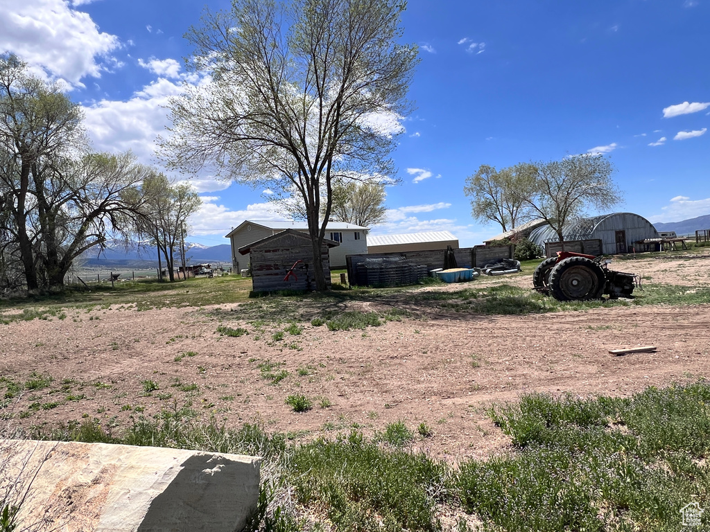 View of yard featuring an outdoor structure and a mountain view