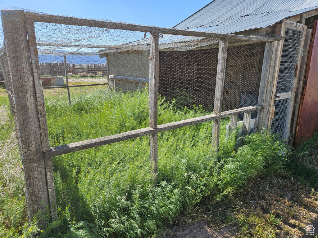 View of yard with exterior structure and an outdoor structure