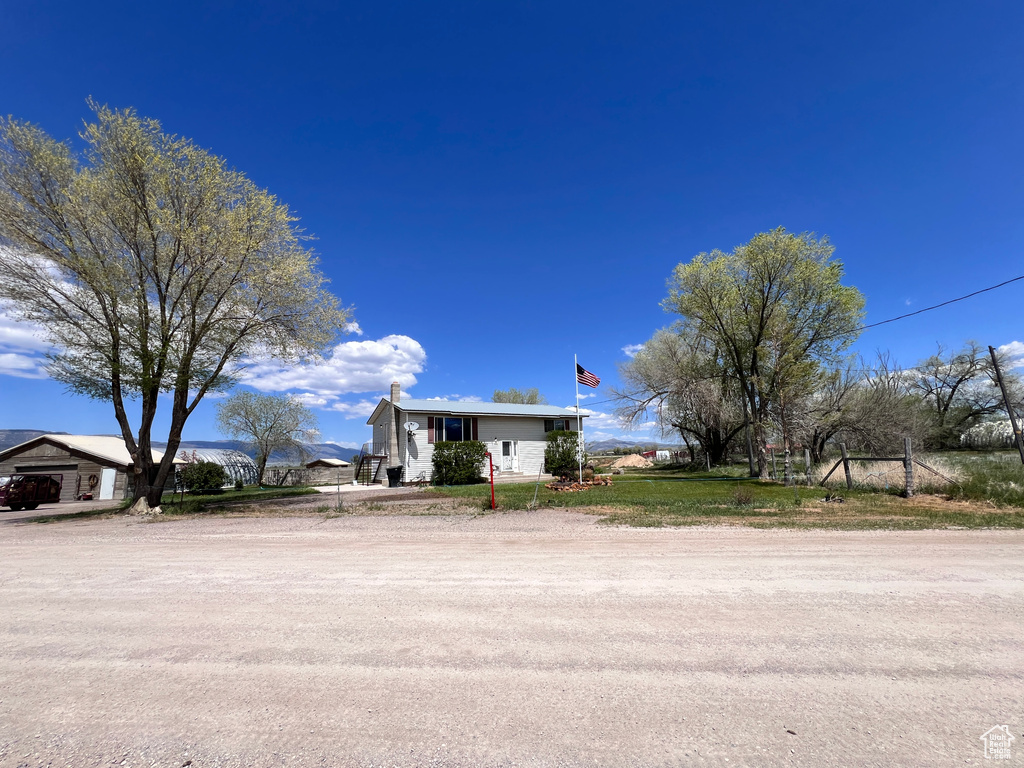 View of front of home featuring a chimney