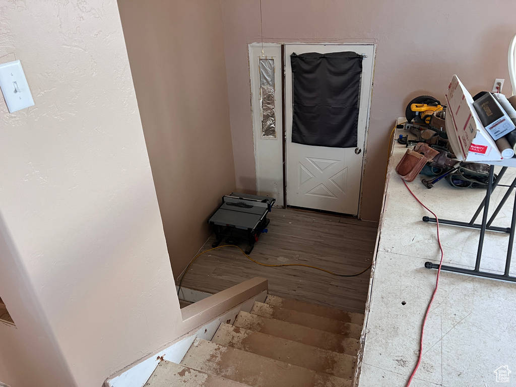 Doorway to outside with wood finished floors