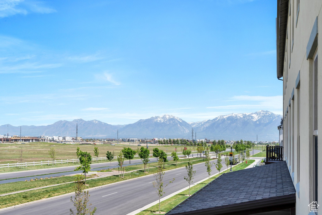View of mountain backdrop with rural landscape