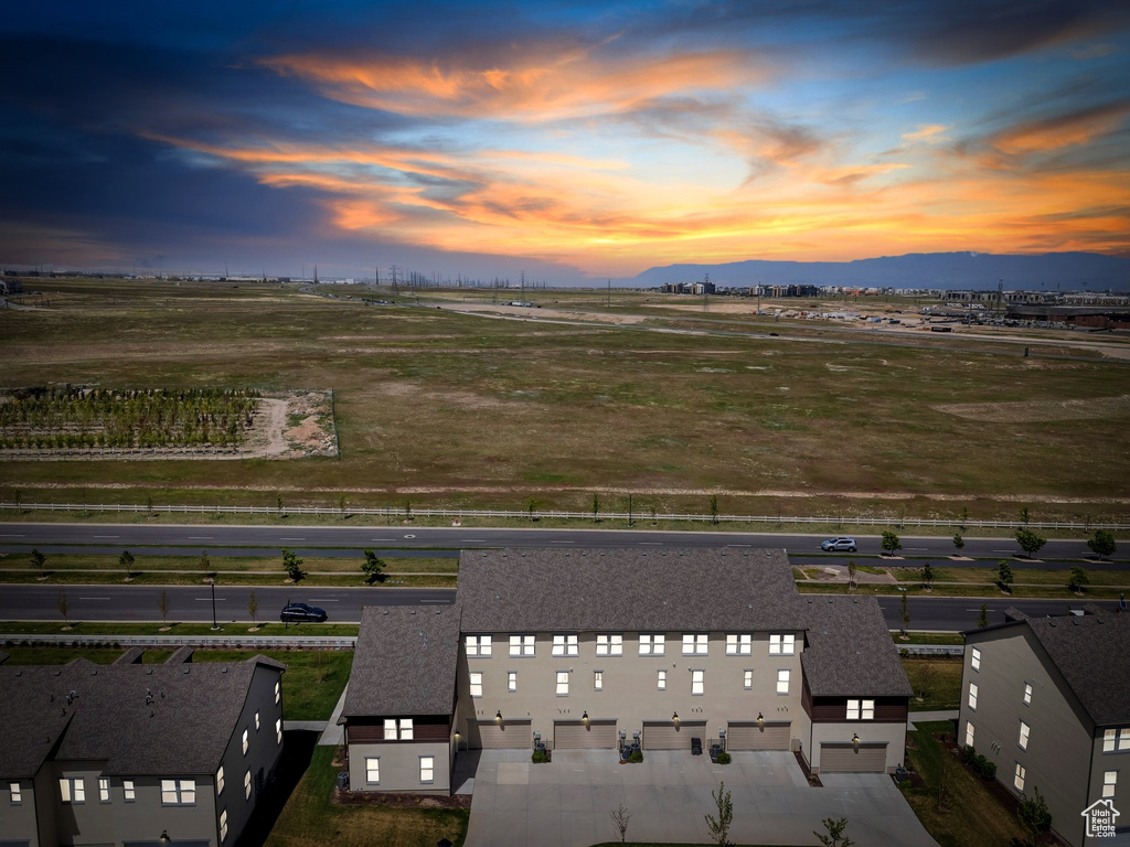 Aerial view at dusk of a view of rural / pastoral area and a mountain view