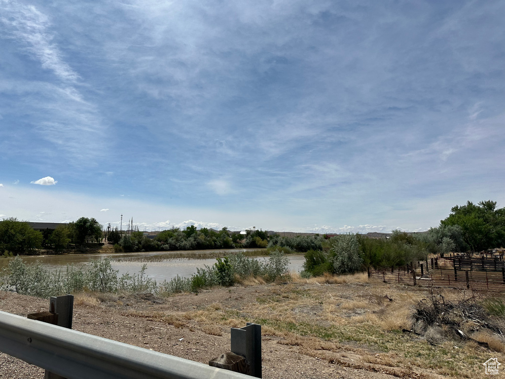 View of yard with a water view