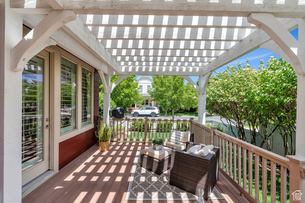 Wooden terrace featuring a pergola
