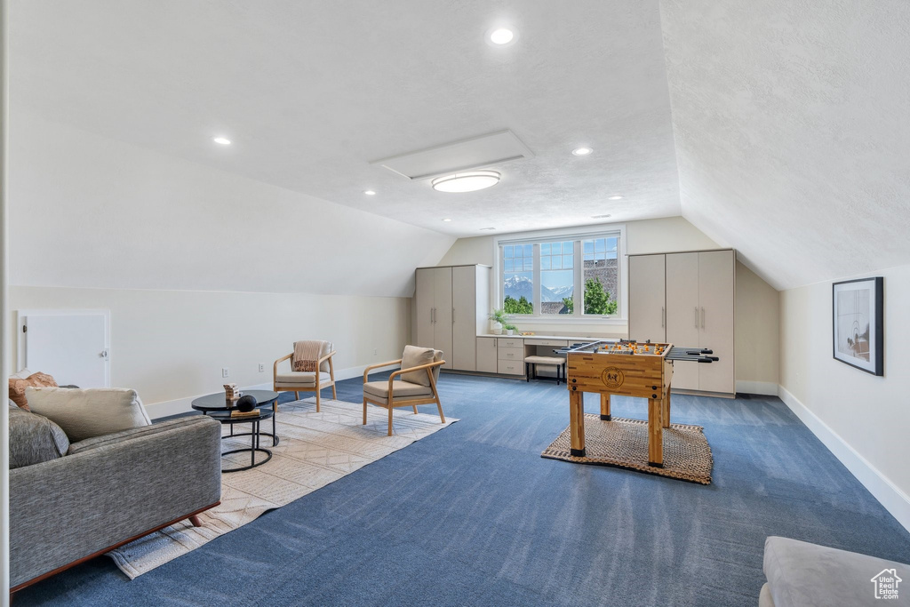 Rec room with attic access, baseboards, vaulted ceiling, carpet flooring, and recessed lighting