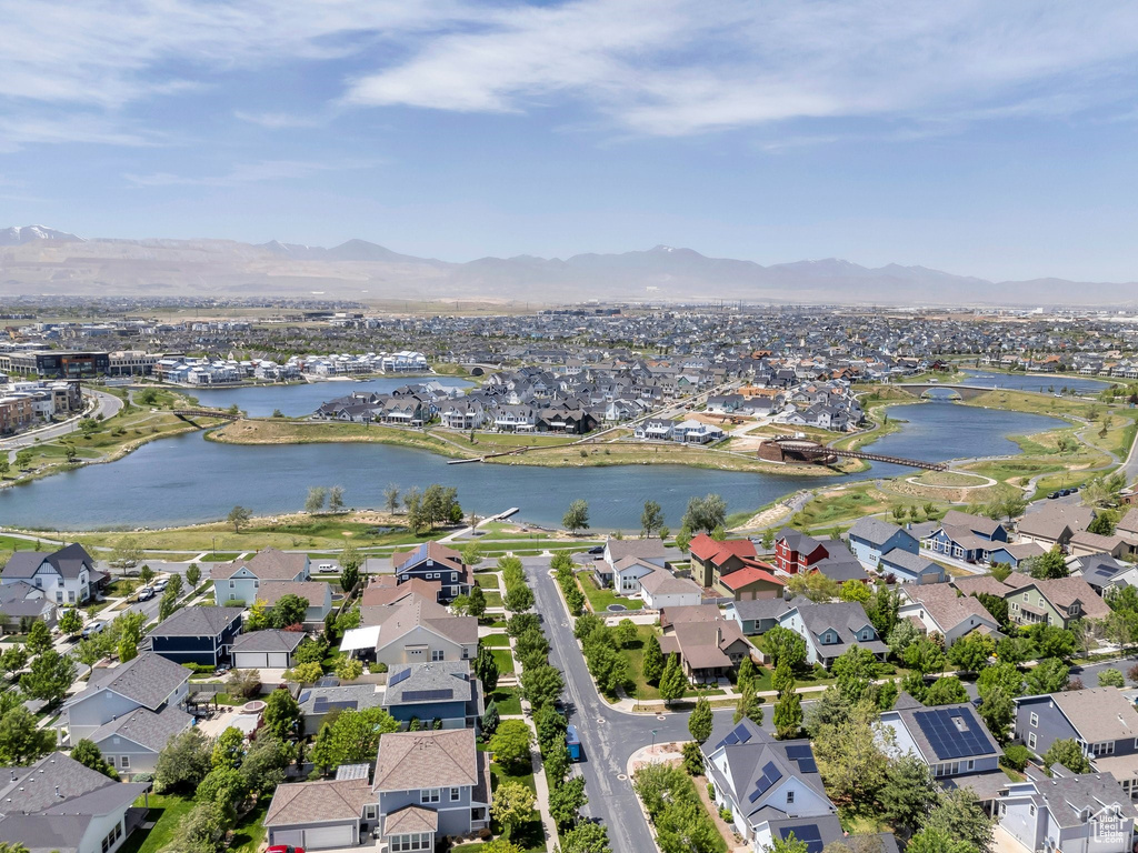 View of property location featuring nearby suburban area and a water and mountain view