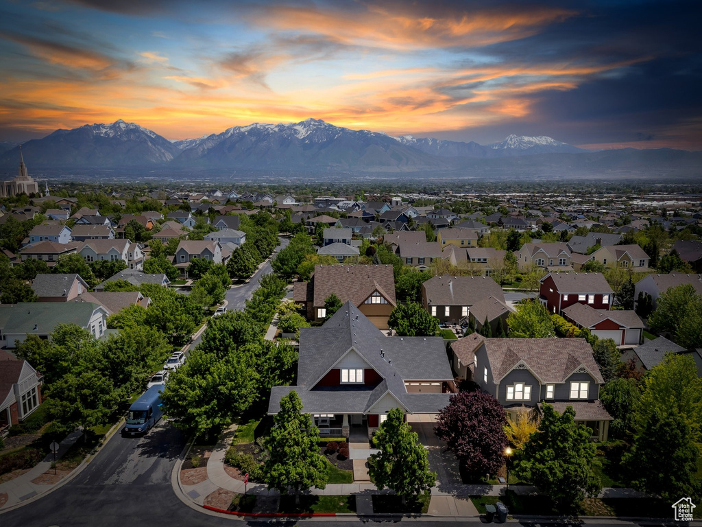 Aerial view of residential area featuring a mountainous background