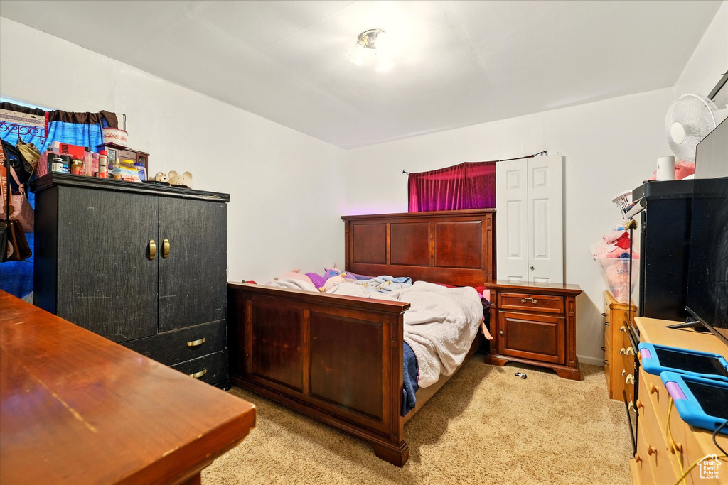 Bedroom with light carpet