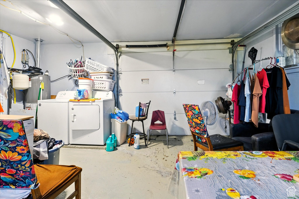 Garage with washing machine and dryer and gas water heater