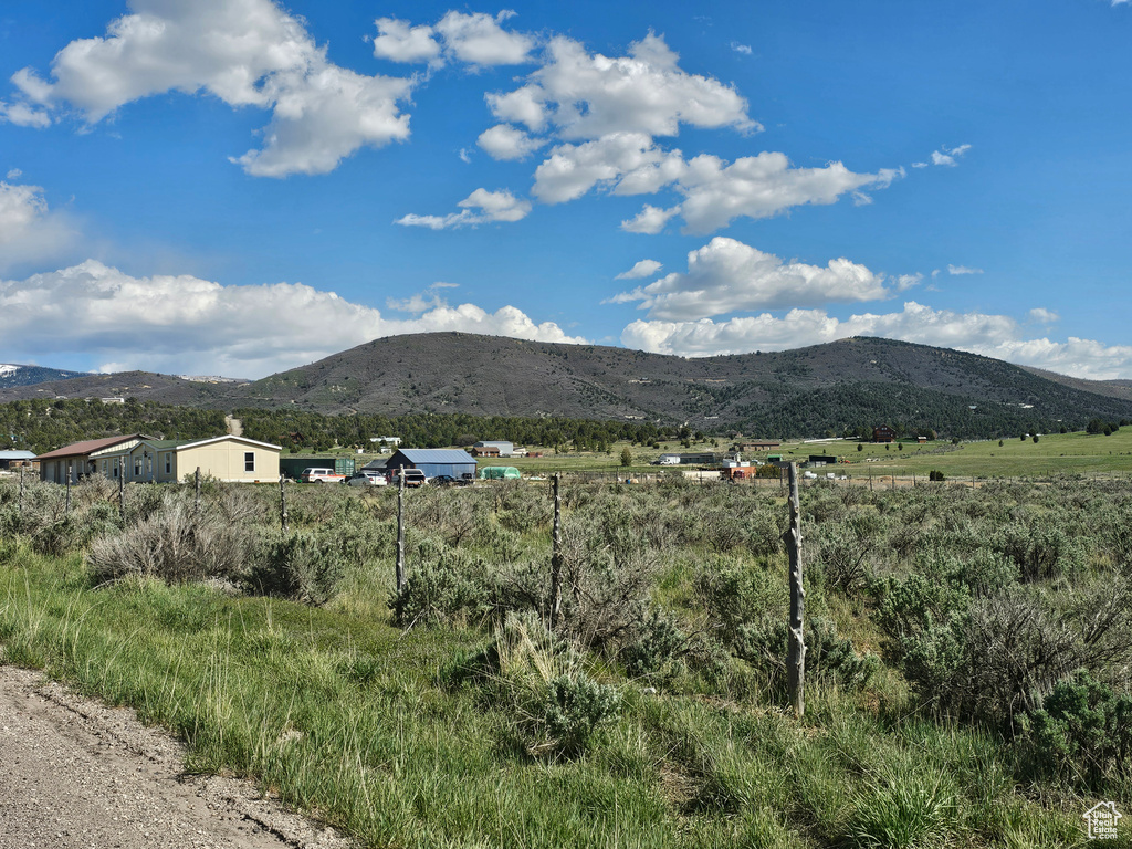 View of mountain background featuring rural landscape