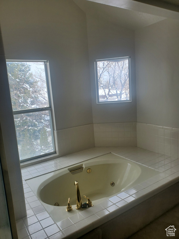 Bathroom featuring a tub with jets