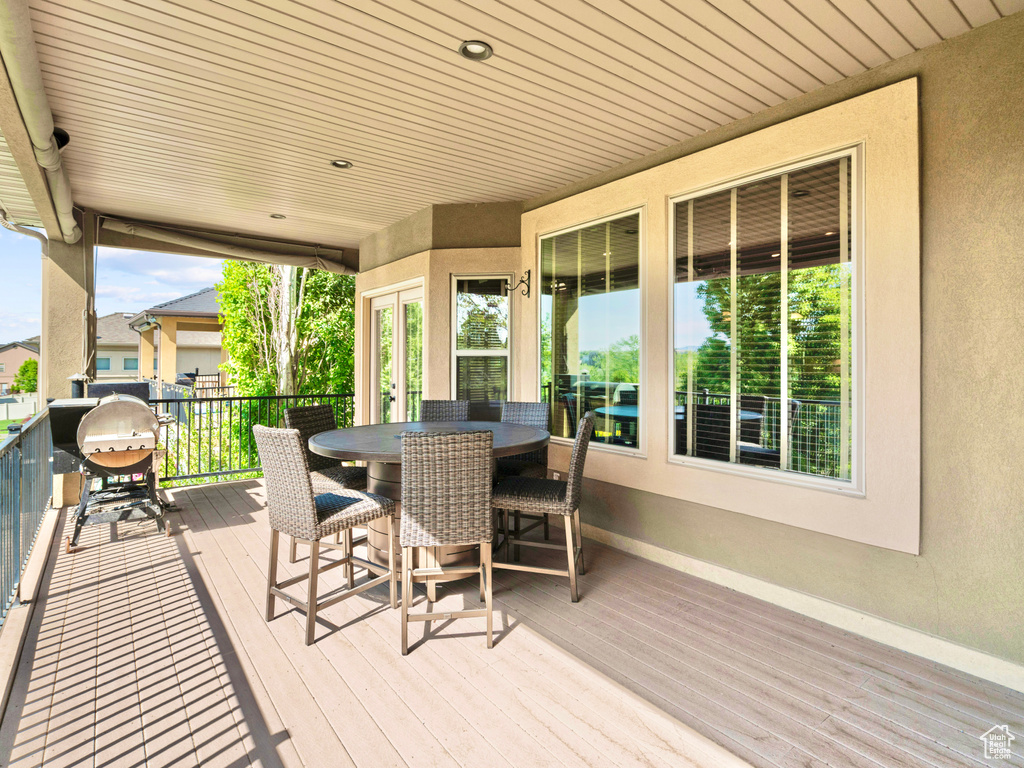 Deck featuring outdoor dining area and area for grilling